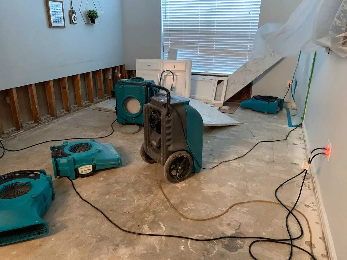 Dehumidifier in flood-cut room for Water Damage Restoration in Hilltown